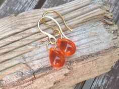 These beautiful little drop earrings are made with a smooth orange Czech glass teardrop. These are light and lovely earrings to wear every day, to dress up a casual outfit or for a special occasion. The drop beads are top quality czech glass, beautiful clear shade  and intens clarity of colour and glossy finish. Colour varies depending on the light conditions from light to dark. Teardrop size is 10 x 14 mm (approximately 1/2 inch). The whole length from the top of the ear hook is 30 mm (1,18 in) Amber Teardrop Earrings Gift, Amber Teardrop Earrings As A Gift, Amber Teardrop Drop Earrings For Gift, Gift Teardrop Earrings With Lever Back Ear Wires, Gift Teardrop Earrings With Lever Back, Everyday Hypoallergenic Orange Earrings, Orange Teardrop Jewelry With Matching Earrings, Orange Teardrop Earrings As Gift, Handmade Orange Teardrop Earrings For Gift