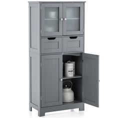 a gray cabinet with two doors and one door open to reveal an empty jug on the bottom shelf