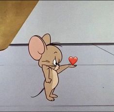 a cartoon mouse holding a red heart in it's hand