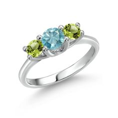 three stone ring with green and blue topazte stones on the sides, set in white gold