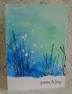 a card with watercolor and ink on it that says peace & joy in the snow