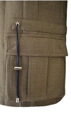 This khaki-green gabardine jacket is a streamlined take on a utility style with padded shoulders – a signature of the house – hidden front button closure, and flap-front pockets.Main - 100% Wool Lining - 100% Cotton Made in FranceSize FR48 - S Shoulder to shoulder 17" Pit to pit 19.5" Waist 36" Length 27.5" Size FR50 - M Shoulder to shoulder 18" Pit to pit 20.5" Waist 37" Length 27.5" Military Style Blazer With Patch Pockets For Work, Military Style Workwear Blazer With Patch Pockets, Military Blazer With Patch Pockets For Work, Khaki Utility Jacket With Welt Pockets For Work, Khaki Utility Jacket With Side Pockets For Work, Classic Olive Utility Jacket With Flap Pockets, Military Style Khaki Outerwear With Welt Pockets, Khaki Military Outerwear With Welt Pockets, Military Style Blazer With Flap Pockets For Work