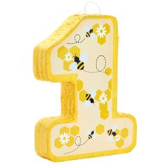 the number one is made out of yellow and white paper, with bees on it