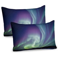 two pillows with the aurora lights on them