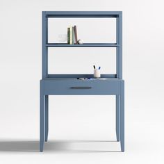 a blue book shelf with books on it and a cup next to it, in front of a white background