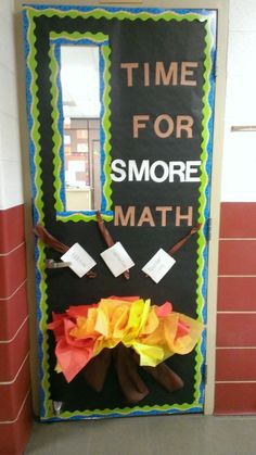 a door decorated with tissue paper and some writing on it that says time for smore math