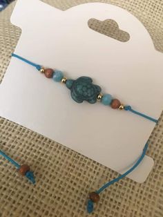 a blue bracelet with a turtle on it