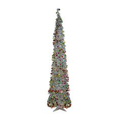 a white christmas tree with lots of lights on it's top and decorations around the base