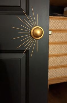 a black door with gold sunburst knobs on it's front and side