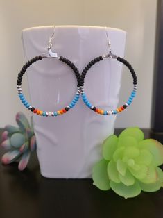 Handmade Colorful Czec glass seed bead earrings Southwestern Style Hoop Earrings Hoop size is 1 1/2 inches in diameter  Silver plated earwire Lightweight earring, perfect for casual wear.  I can imagine these earrings worn with a tank top and jeans to add a splash of color to your outfit! Handmade Casual Hoop Jewelry, Adjustable Colorful Beaded Round Earrings, Southwestern Beaded Round Earrings, Southwestern Round Beaded Earrings, Southwestern Style Beaded Round Earrings, Southwestern Style Beaded Dangle Hoop Earrings, Adjustable Southwestern Beaded Earrings With Ear Wire, Hypoallergenic Beaded Earrings With Round Beads For Summer, Everyday Colorful Beaded Round Earrings