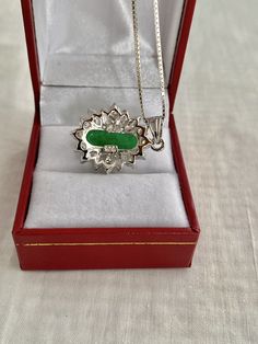 "Free Shipping on orders over $35.00 however if there is a return buyer to refund seller for the free shipping cost to seller. Stunning Necklace Pendant Oval Simulate Cabochon Jade CZ Marquise & Round Accents 925 Sterling Silver Pendant Box Chain Hallmark - 925 Chain .& pendant marked 925 Top measures - 0.95\" x 0.81\" Beautiful like new Visit our Etsy shop's HauteCoutureLaLa TrendsCouture BeautifulPatina LastingTrends BorrowedTrendsFree Shipping on orders over $35.00 however if there is Hallmarked Oval Jade Necklaces, Oval Jade Necklaces With Hallmark, Oval Jade Necklace For Anniversary, Silver Jade Cabochon Necklace, Silver Necklace With Jade Cabochon, Oval Cabochon Jade Jewelry Gift, White Gold Oval Cabochon Necklace Gift, Silver Jade Oval Pendant Jewelry, Silver Jade Necklace With Oval Pendant