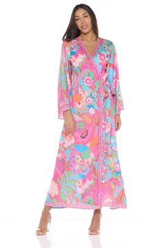 Go from beach to boardwalk in a flowery border-print cover-up wrap with a front-tie closure for easy layering. 54" length Shawl collar Long sleeves 100% polyester Hand wash, dry flat Imported Multicolor Printed Wrap Cover-up, Spring Bohemian Tie Waist Cover-up, Spring Beach Cover-up Kimono With Tie Waist, Spring Beach Robe With Tie Waist, Long Sleeve Beach Robe With Tie Waist, Spring Kimono With Tie Waist For Beach, Floral Print Wrap Beachwear Cover-up, Multicolor Print Kimono For Spring Beach Cover-up, Summer Beach Robe With Tie Waist