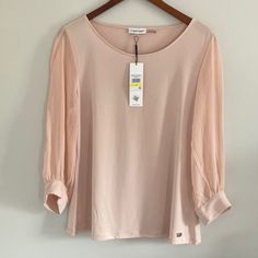 Blush Pink Blouse With Sheer 3/4 Length Sleeves. Brand: Calvin Klein Size: Medium Material: 95% Polyester 5% Spandex Measurements: Armpit To Armpit-20.5” Length From Shoulder-24.5” Condition: New With Defects- Small Spot Near Bottom Metal Tag. Metal Tag Is Missing A Few Threads Pink 3/4 Sleeve Top For Work, Calvin Klein Stretch Tops For Spring, Spring Stretch Calvin Klein Tops, Calvin Klein Spring Tops, Chic Stretch Tops By Calvin Klein, Blue Work Shirt, Blush Pink Blouse, Zipper Blouse, Calvin Klein Top