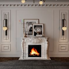 a fire place in a room with pictures on the wall and lamps hanging above it