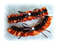 Bridal garter, wedding garter, burnt orange and chocolate brown wedding accessoriesGorgeous garter set made of satin material in rich chocolate brown and burnt orange colors, one to keep and one to toss. ** AT THIS TIME ALL ORDERS TAKE 4-5 WEEKS TO MAKE and SHIP OUT** order accordingly. If you need the items sooner let me know prior to ordering. Due to the nature of special occasion items all sales are final, in the wedding industry this is standard procedure. Feel free to ask before you commit Brown Fall Wedding, Chocolate Brown Wedding, Orange And Chocolate, Prom Garters, Garter Wedding, Burnt Orange Weddings, Bridal Garters Set, Leg Garter, Wedding Garters