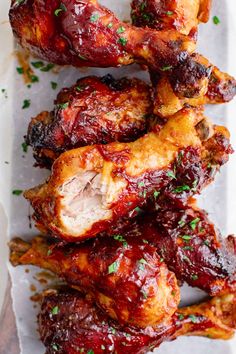 chicken wings covered in bbq sauce and garnished with parsley