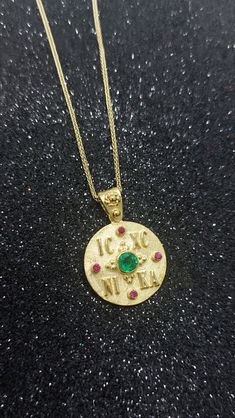 Constantine Solid Gold Coin Pendant with Emerald and Ruby. A Byzantine Handmade ICXC NIKA Charm from 14k Yellow Solid Gol  with Natural precious stone - set with a central Emerald stone of 0.28carats and diameter 4.15mm and 4 Ruby. An ideal choice for a NewBorn Babies protection gift or as a baptismal gift. But also as a special and unique piece of jewelry that you can wear every day.   Details: Charm Size: diametre 18mm Weight: 14k 4.8gr Metal: 14k Yellow Gold Gem Stone: Emerald 0.28ct ❣️ For m Emerald Style, Baby Protection, Emerald Stone, Gold Coins, Cool Necklaces, Coin Pendant, Precious Stones, Unique Pieces, Solid Gold