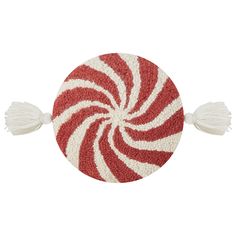 a red and white candy cane on a white background