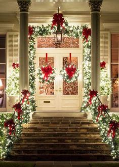 christmas decorations on the front steps of a house