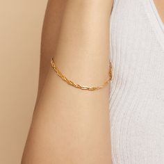 #All Full of vintage allure, our Now & Forever Herringbone Bracelet is a modern take on a true classic. Three petite herringbone chains weave together to form a chic braid of solid gold. The Finer Points: #YellowGold-10kSolidGold-75 Metal: 10k Solid Yellow Gold Dimensions: 3.4mm Wide, 7.5-Inches Long Weight: 2.7 Grams Solid Gold Origin: Crafted in Istanbul, Turkey #TricolorGold-10kSolidGold-75 Metal: 10k Solid Tricolor Gold Dimensions: 3.4mm Wide, 7.5-Inches Long Weight: 2.7 Grams Solid Gold Ori Timeless Gold Curb Chain Bracelet As Gift, Timeless Gold Bracelet With Curb Chain For Gift, Timeless Gold Curb Chain Bracelet For Gift, Adjustable 14k Gold Timeless Chain Bracelet, Elegant Everyday Gold Bracelet With Box Chain, Timeless Adjustable 14k Gold Chain Bracelet, Adjustable Timeless 14k Gold Chain Bracelet, Classic Adjustable Figaro Chain Bracelets, Elegant Everyday Gold Box Chain Bracelet