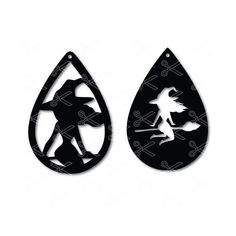 two black and white earrings with an image of a witch