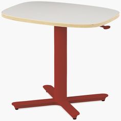 a red and white table sitting on top of a wooden floor