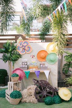 an outdoor party with paper plates and decorations