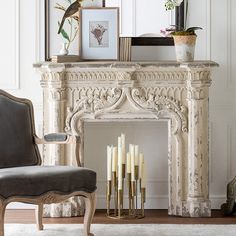 a living room with a fireplace and chairs