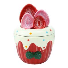 a red and white ceramic container with three plates in it's center, on a white background