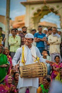 a man holding a basket in front of a group of people