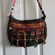 Very Colorful Fabric Purse, Made In Turkey. Front Has 4 Tassels With Beads Room Middle Zipper Pocket 13" X 9.5" Never Used Travel Multicolor Beaded Shoulder Bag, Bohemian Red Beaded Shoulder Bag, Red Bohemian Beaded Shoulder Bag, Bohemian Black Beaded Shoulder Bag, Bohemian Multicolor Bag With Colorful Beads, Multicolor Embroidered Beaded Shoulder Bag For Everyday Use, Multicolor Beaded Embroidery Shoulder Bag For Everyday Use, Beaded Multicolor Embroidery Shoulder Bag For Everyday Use, Bohemian Multicolor Beaded Bag