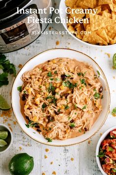 a bowl filled with salsa and tortilla chips next to an instant pressure cooker