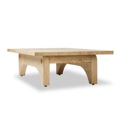 a wooden table sitting on top of a white floor