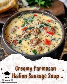 creamy parmesan italian sausage soup in a black bowl with bread on the side