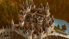 an aerial view of a castle with trees in the background