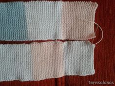 two pieces of knitted fabric sitting next to each other