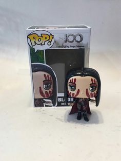 the walking dead pop vinyl figure is in front of a box with it's cover open