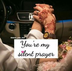 a man and woman sitting in a car holding hands with the words you're my silent prayer