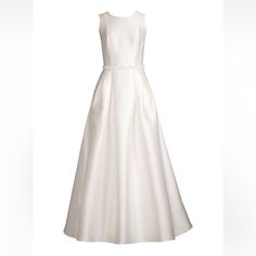 a white dress on a mannequin neckline with a bow at the waist