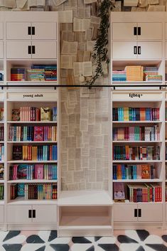 the bookshelves are filled with many different types of books