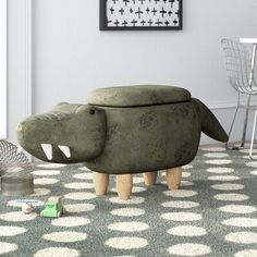 an animal shaped stool in the middle of a room with polka dots on the floor