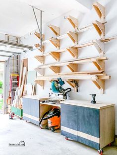 a garage with lots of shelves and tools on the wall, including a circular sawhorse