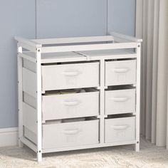 a white toy chest with four drawers