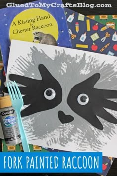 a close up of a paper plate with a raccoon on it next to other children's books