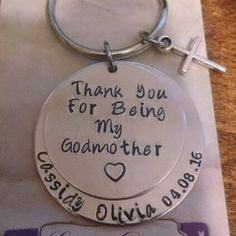 a keychain that says, thank you for being my godmoter