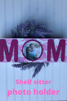 a mother's day photo frame with the word mom spelled in pink and purple