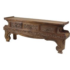 an old wooden bench with carved carvings on it's sides and bottom shelf, against a white background