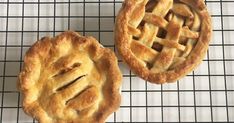 two pies sitting on top of a cooling rack