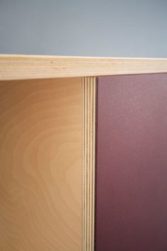 a close up of a wooden shelf with wood grains on the top and bottom