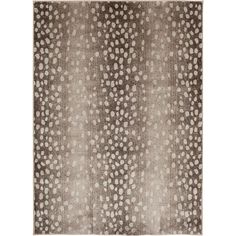 a brown and white rug with dots on it